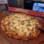 Sausage and red onion pizza at Flo and Santos